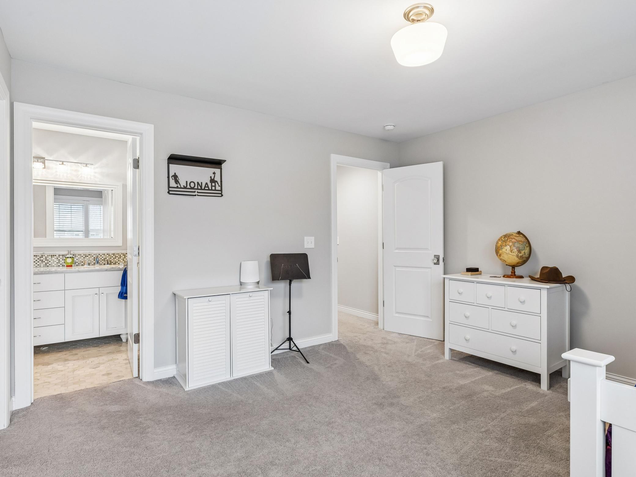 Door to the left is the jack and jill bathroom, door to the right leads back out to the hallway