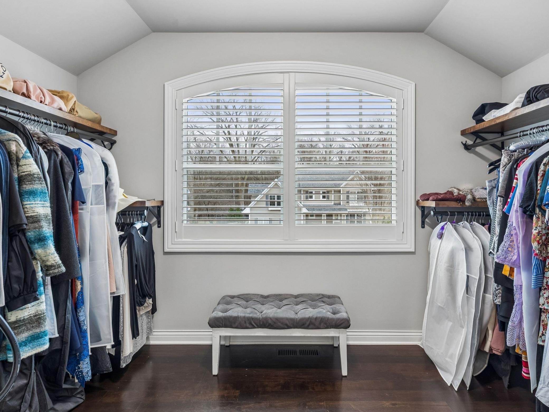 Large walk-in closet with ample natural light