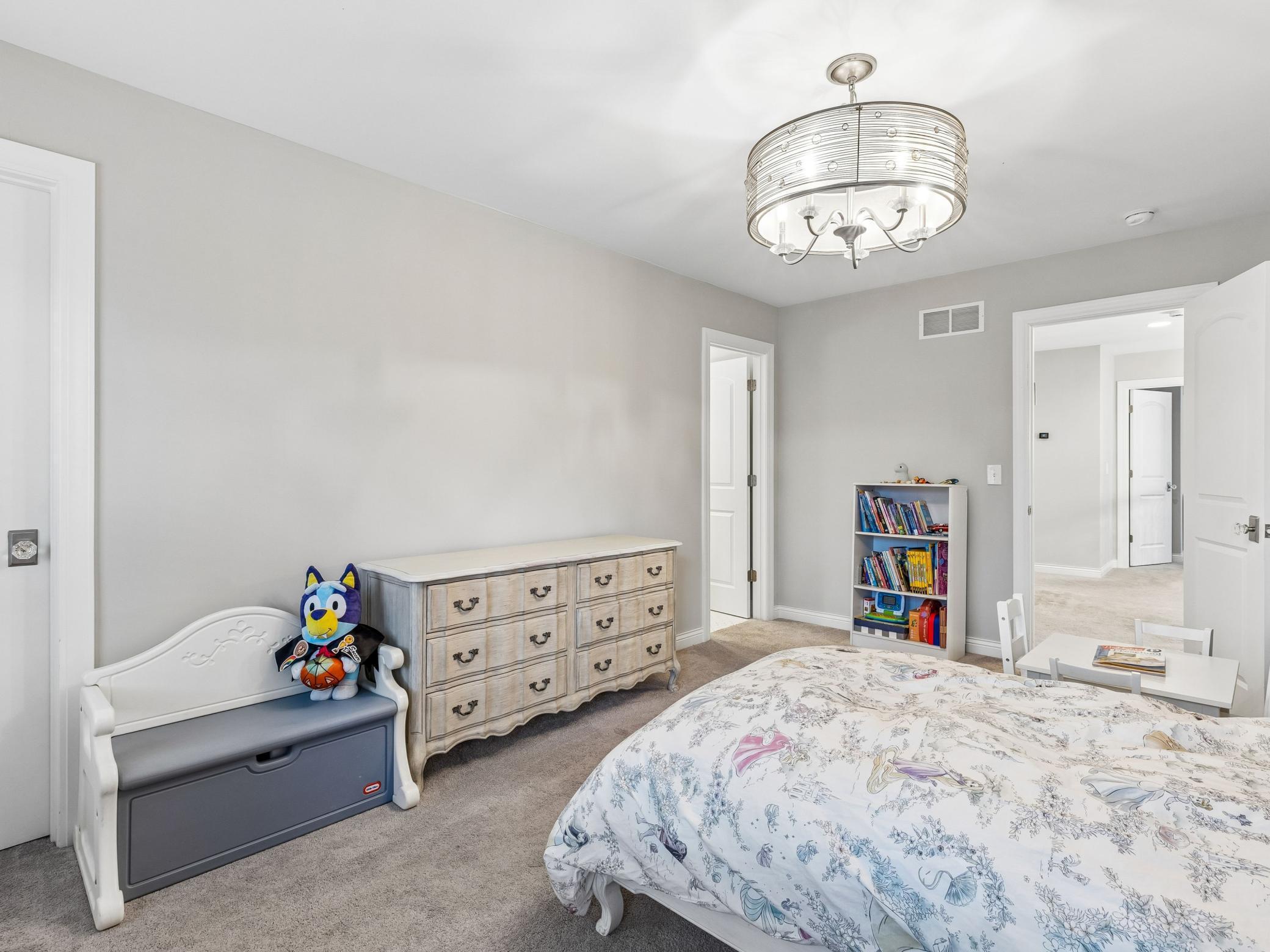 Door on left leads to ensuite bathroom, door on the right leads back to the hallway with other rooms