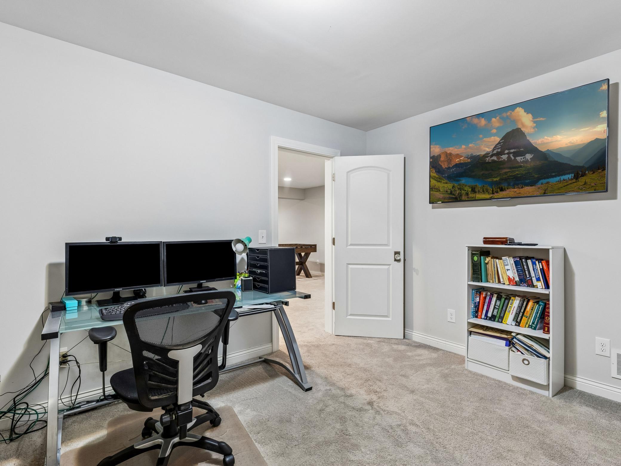 Lower level den could act as an office space or workout area