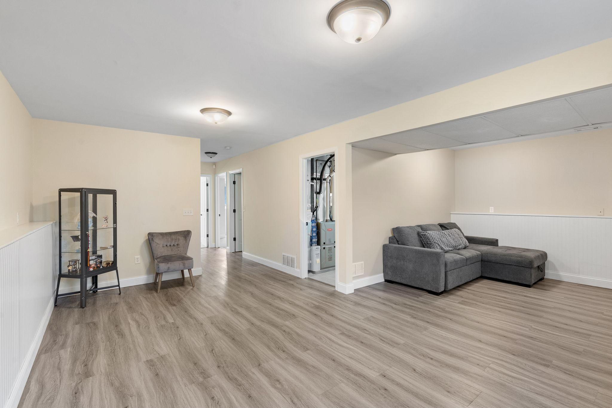 Through the door to the mechanical room is a newer washer and dryer, furnace, AC, water heater, water softener and water filtration system.