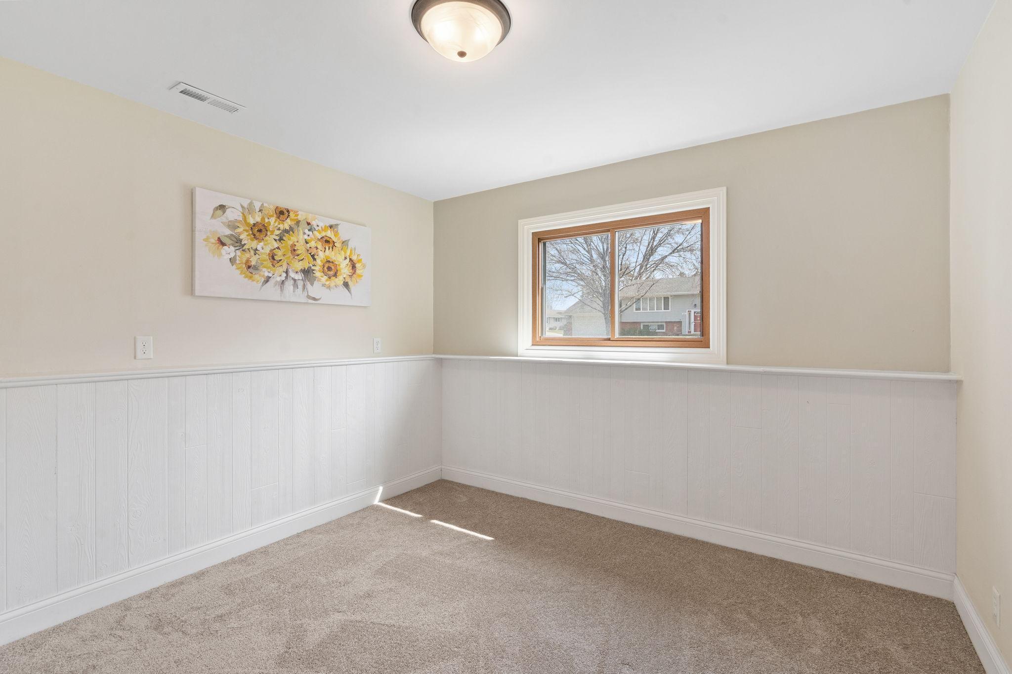 New carpet (2026) in the 4th lower level bedroom.