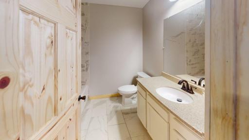 Unit 1--Full bathroom --tiled floors/shower