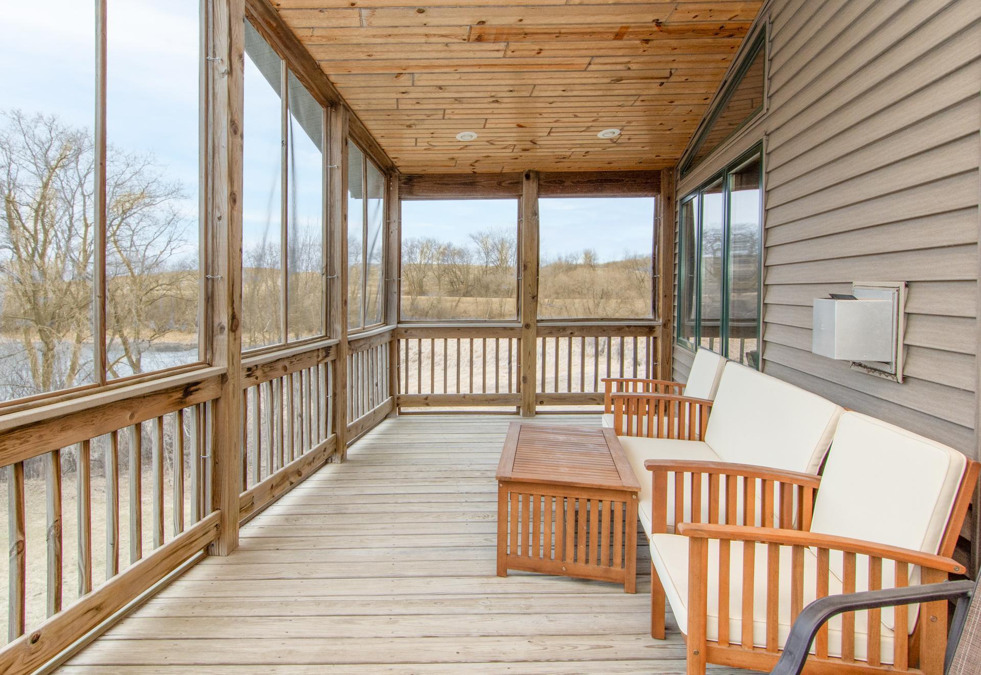 Relax or entertain on the screened deck overlooking the lake—perfect for enjoying peaceful mornings and sunsets.