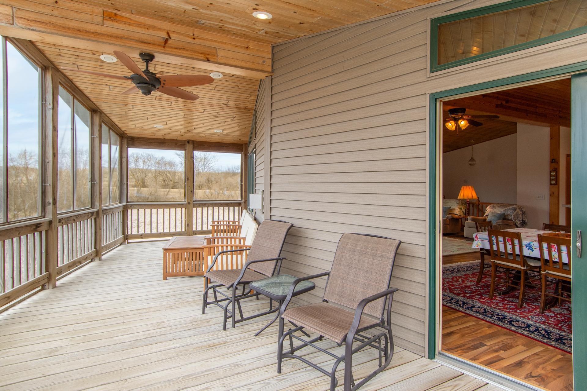 Screened deck with stunning lake views—perfect for relaxing without the bugs.