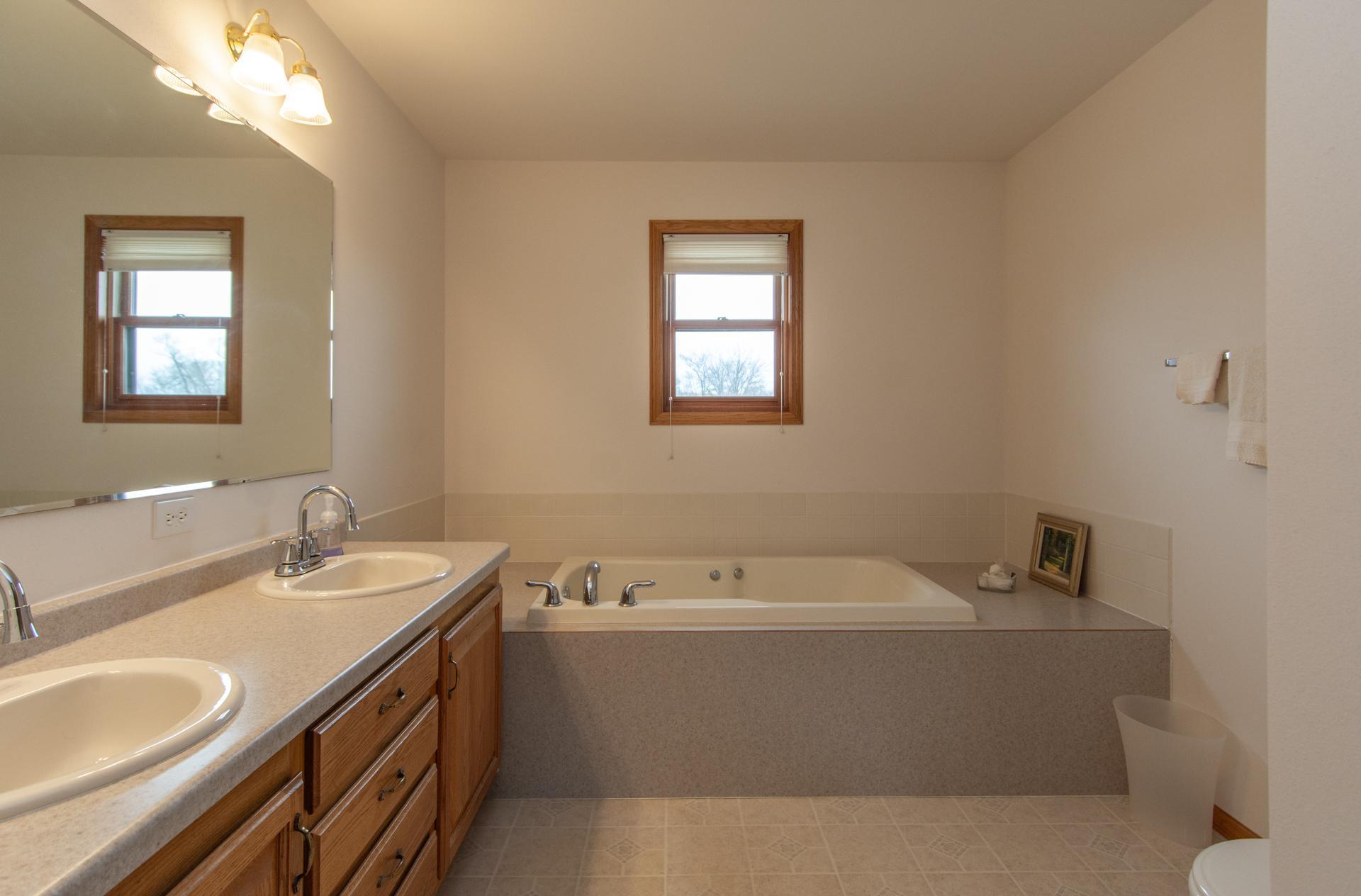 Convenient en-suite bath off the primary bedroom.