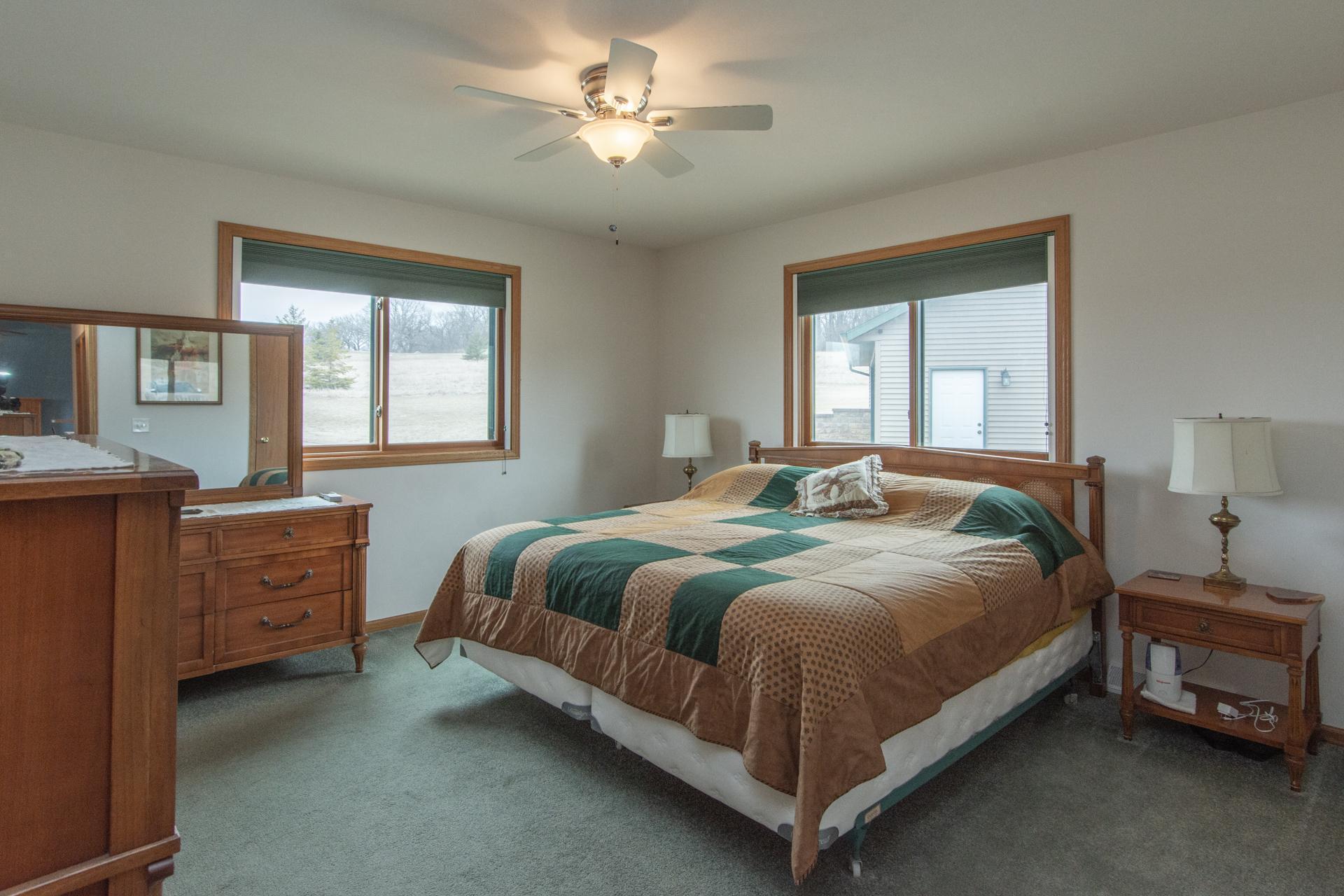 Spacious primary bedroom featuring its own private full bath.