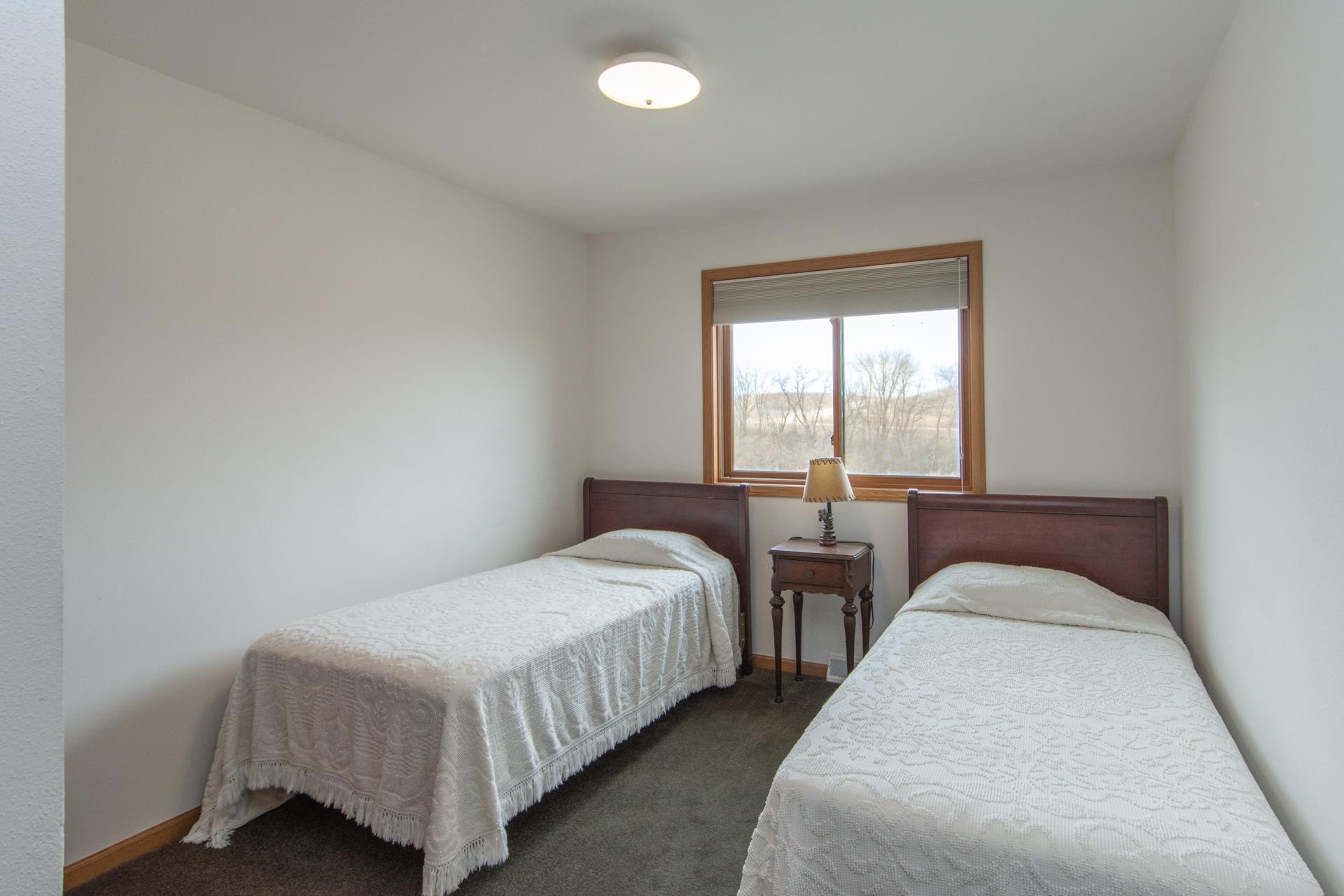 Third bedroom ideal for guests, family, or office space.