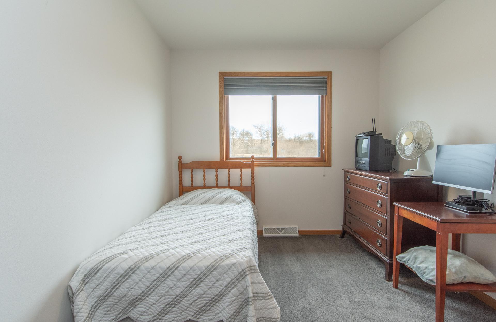 Comfortable second bedroom with great natural light.