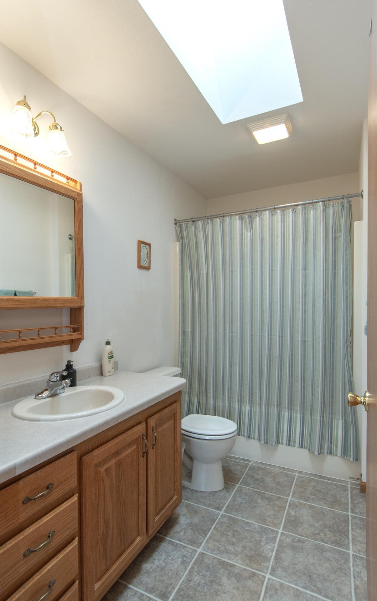 Second full bath serving the additional bedrooms and guests.