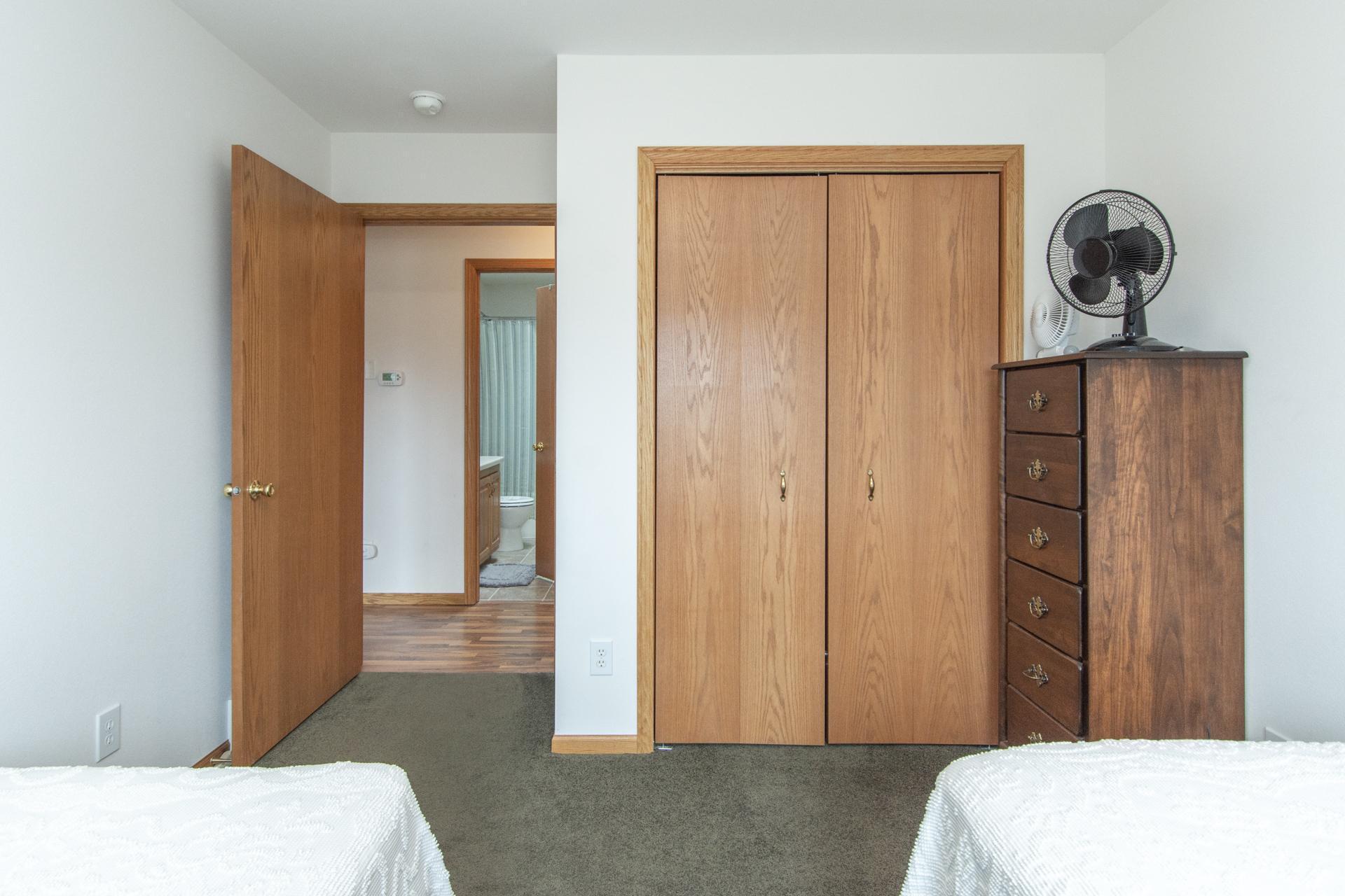 Well-sized closet offering convenient storage solutions.