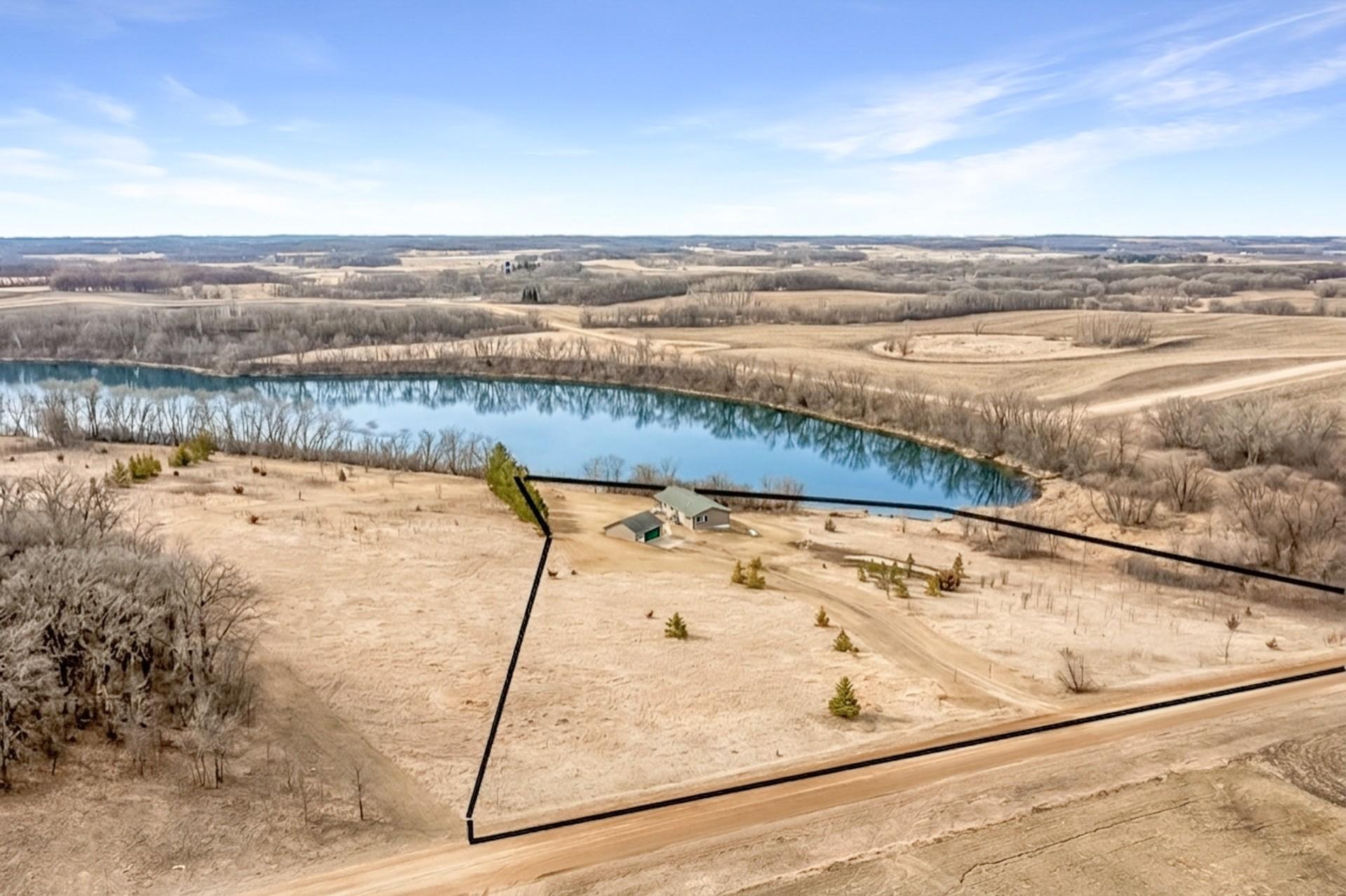 Expansive 5-acre property with over 600 feet of shoreline on beautiful Bass Lake.