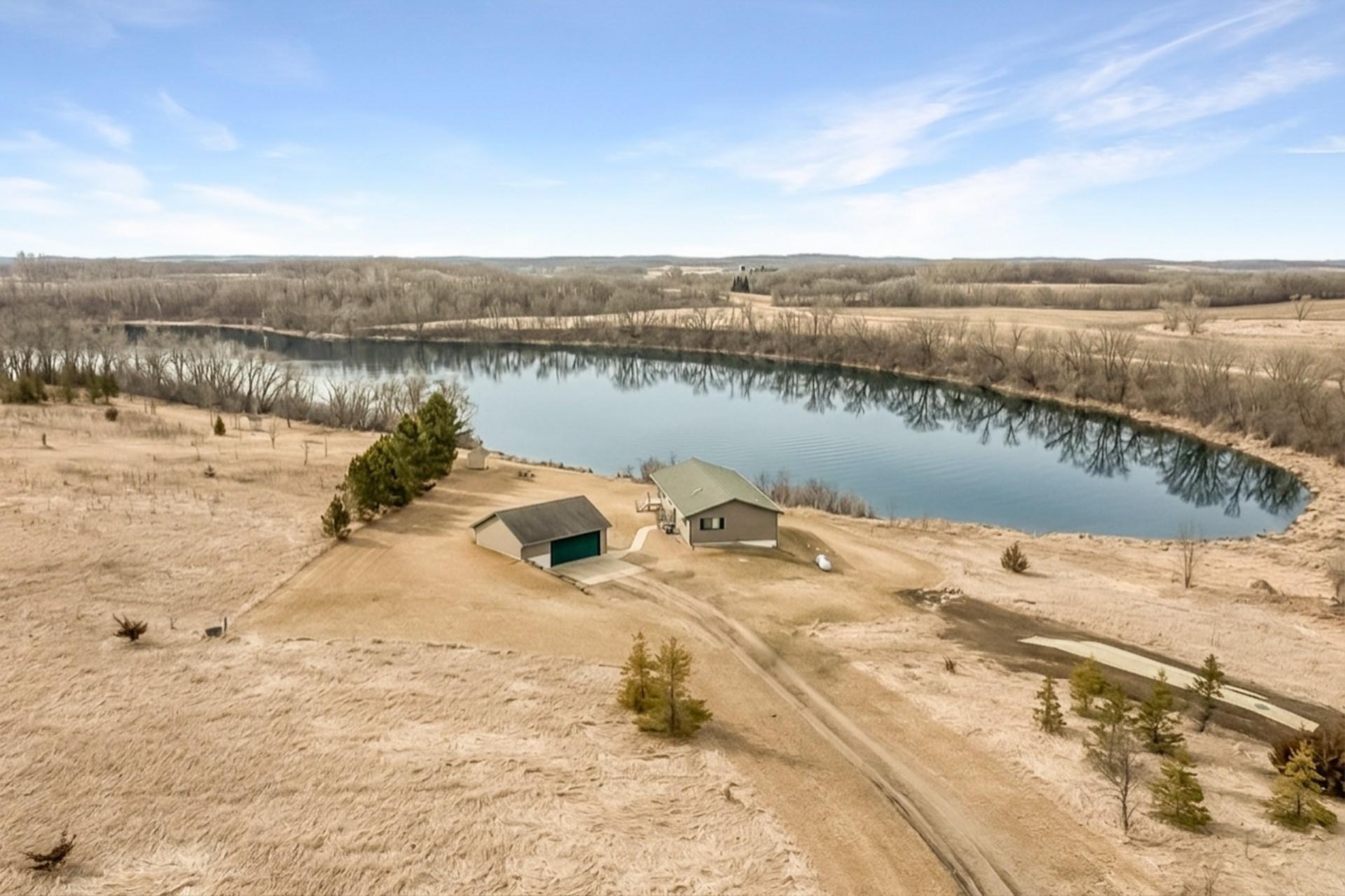 Long driveway enhances privacy and provides ample parking for guests.