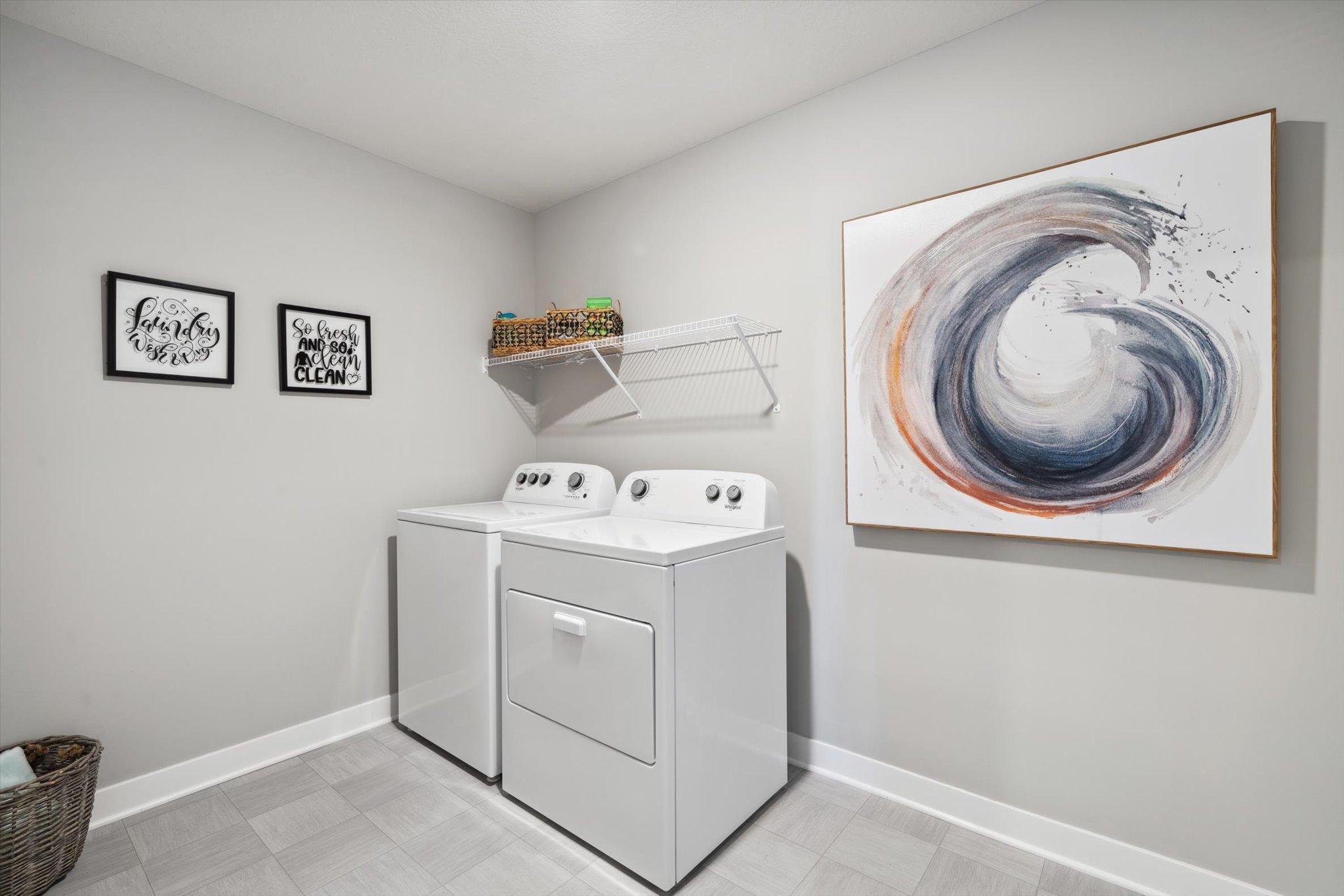 A spacious laundry room with plenty of room to sort and organize laundry