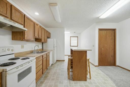 SE Main Floor Apartment features an island in the kitchen.