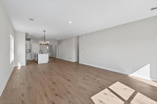 Living room with tons of natural sunlight flowing through!