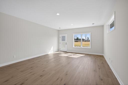 Living room with tons of natural sunlight flowing through!