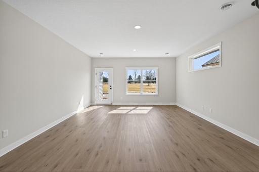 Living room with tons of natural sunlight flowing through!