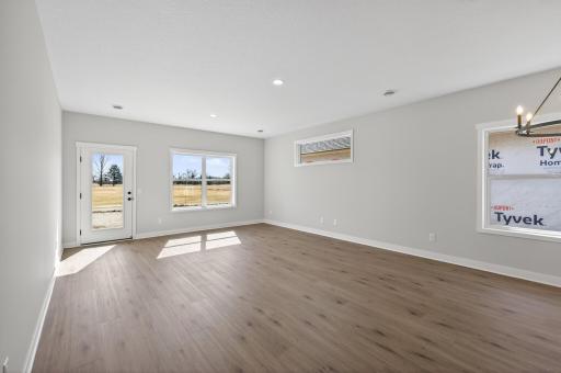 Living room with tons of natural sunlight flowing through!