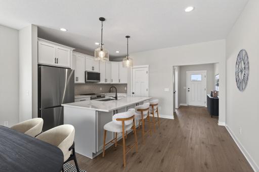 Kitchen with oversized island and pantry. *Virtually staged