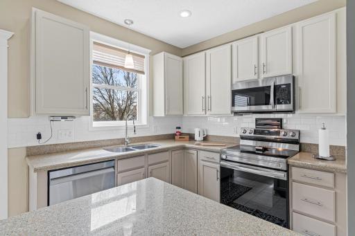 The kitchen window allows the light to flow into the space.
