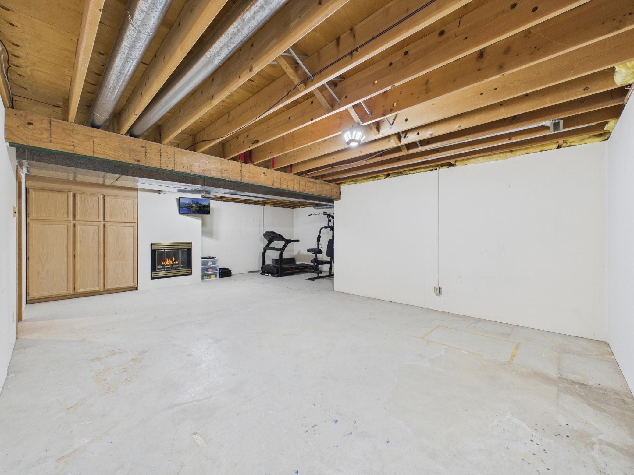 Lower level family room isn't finished, but has a working gas fireplace and great space for a second living area.