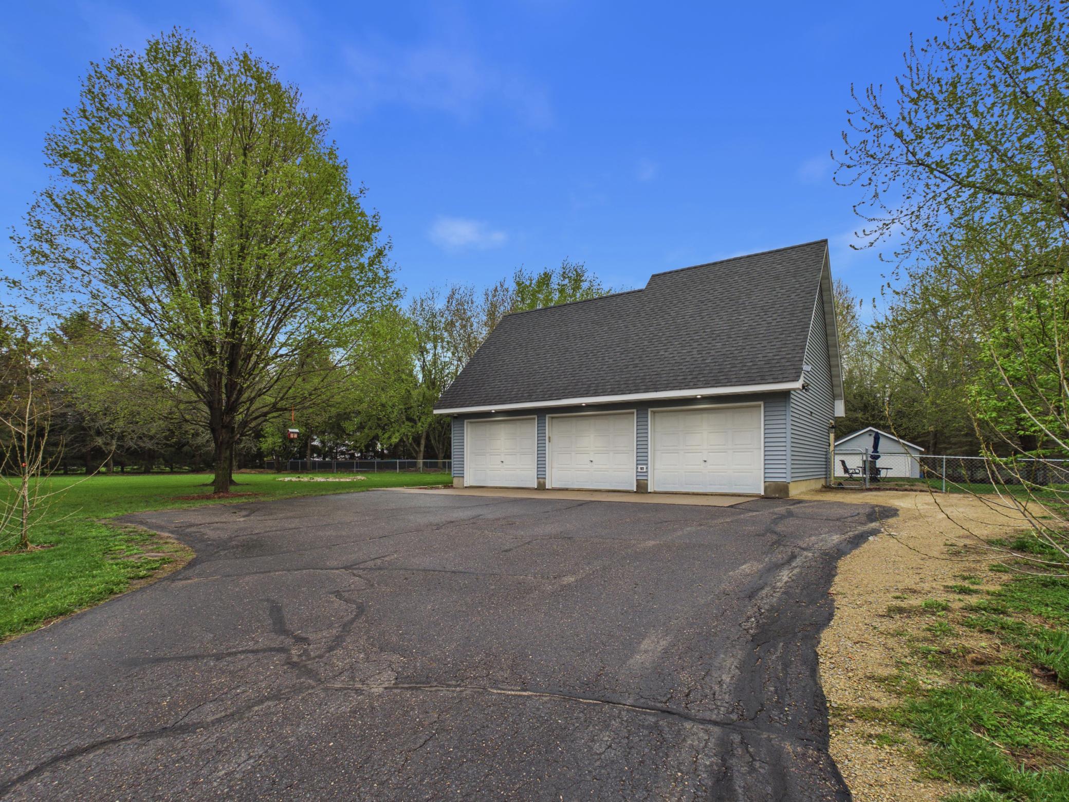 Drive right into your three car garage with additional space and space on the side for extra parking.
