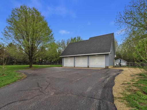 Drive right into your three car garage with additional space and space on the side for extra parking.