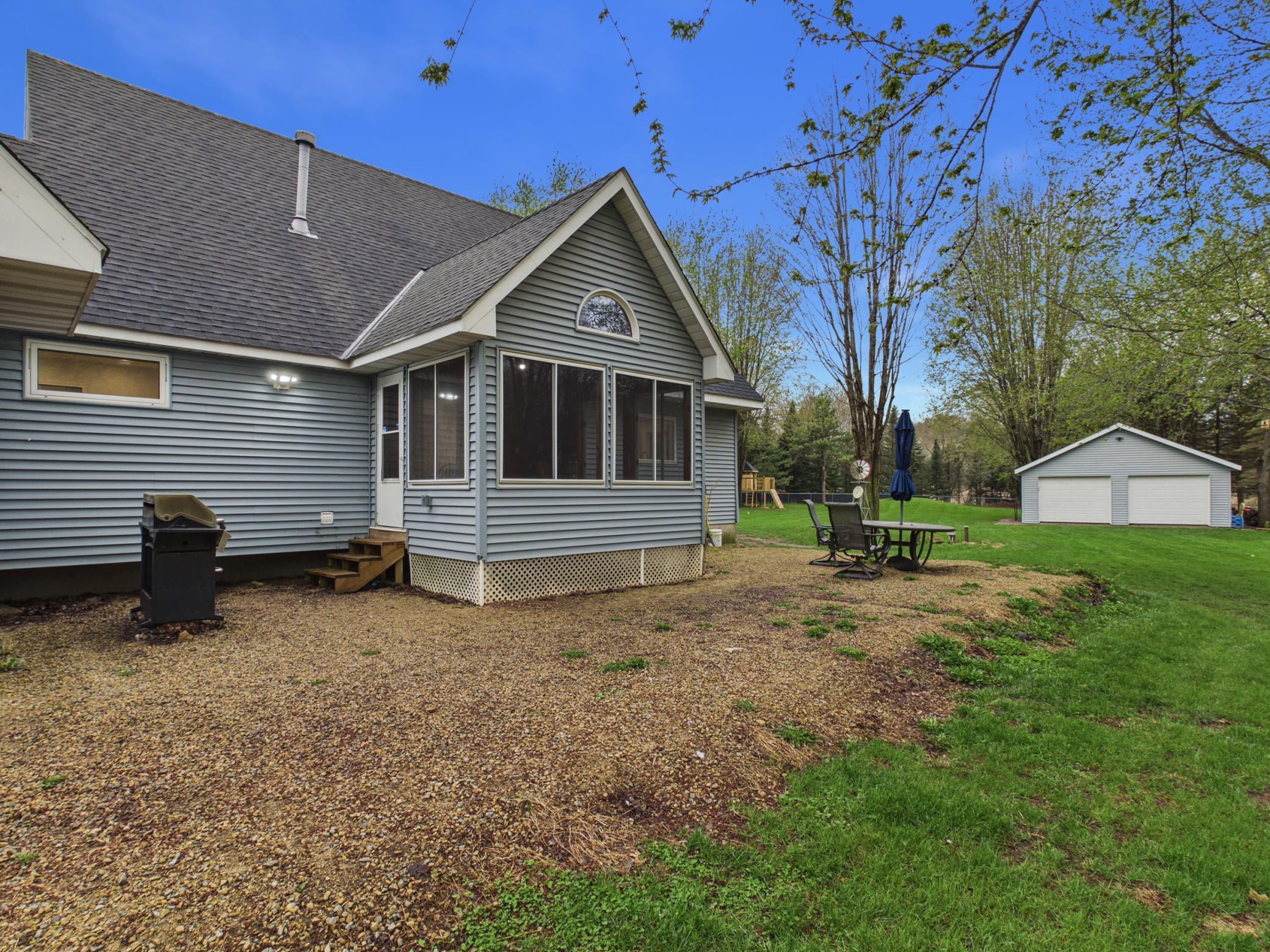 Back of the home off the three seasons porch, great entertaining space.