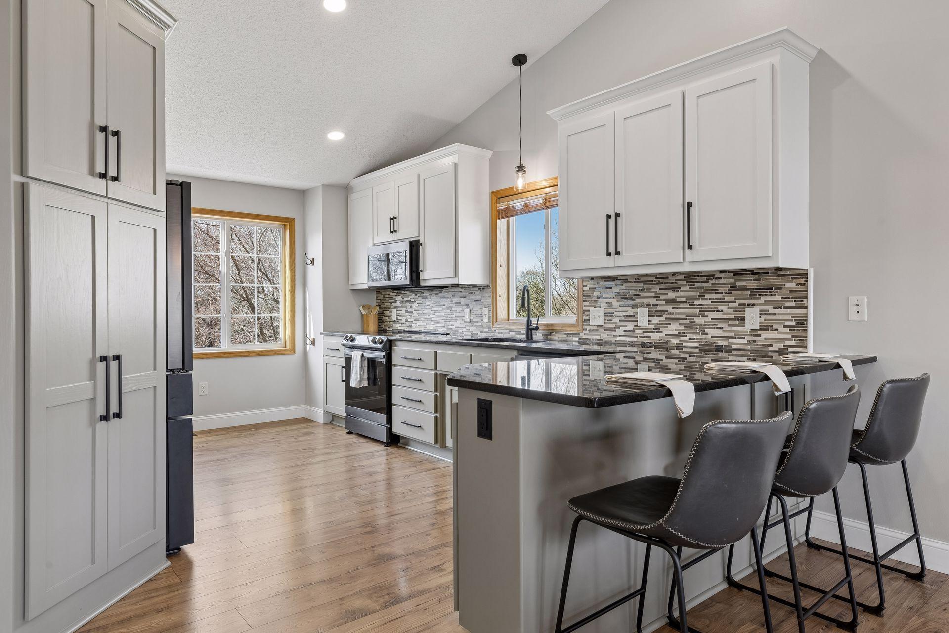 Updated kitchen in 2024, including new appliances. New high end LVP flooring runs through entire upper level.