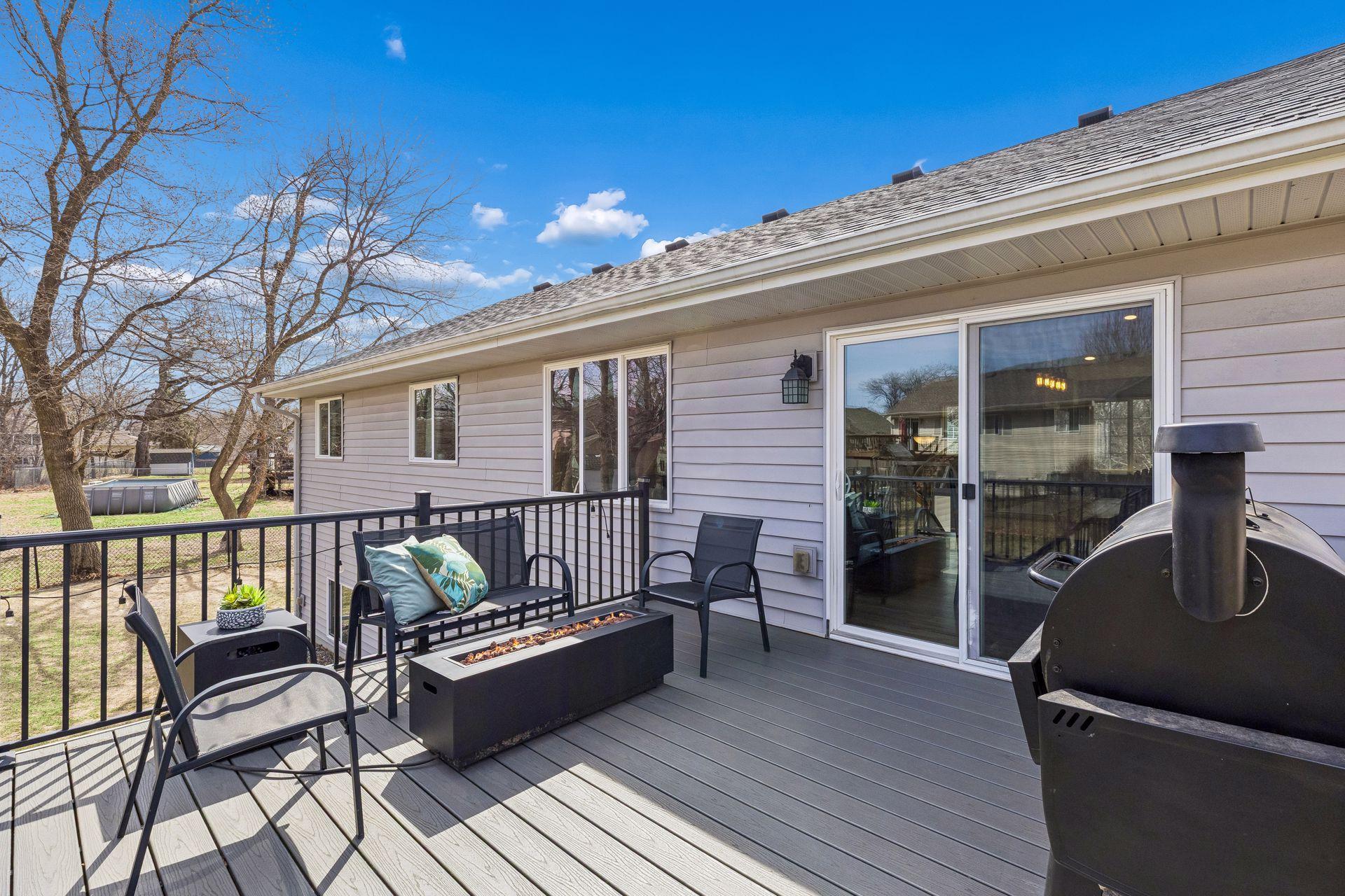 Spacious maintenance free deck off the dining room that has steps to the flat fully fenced back yard.