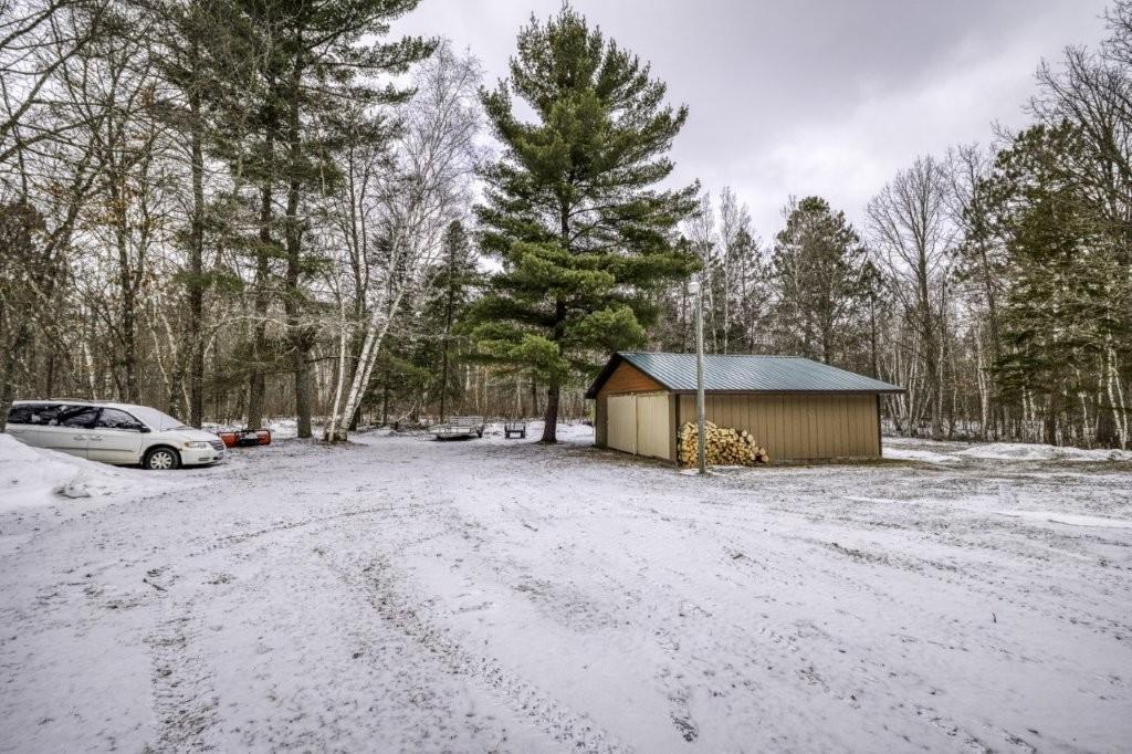 extra garage in back woods behind house.jpg