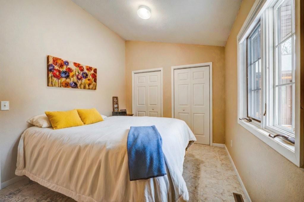 Cozy bedroom with yellow accents and poppies.jpg