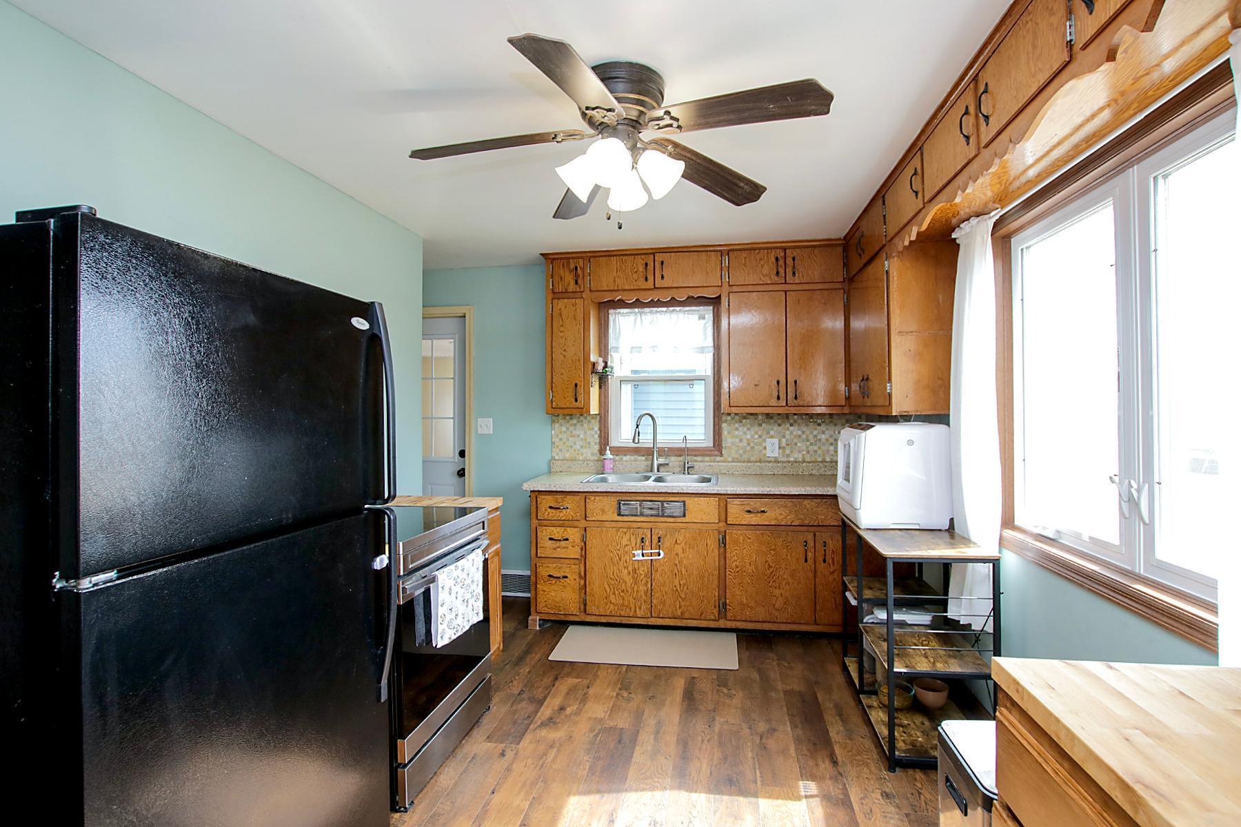 Lots of cabinets with charming scalloped detail!