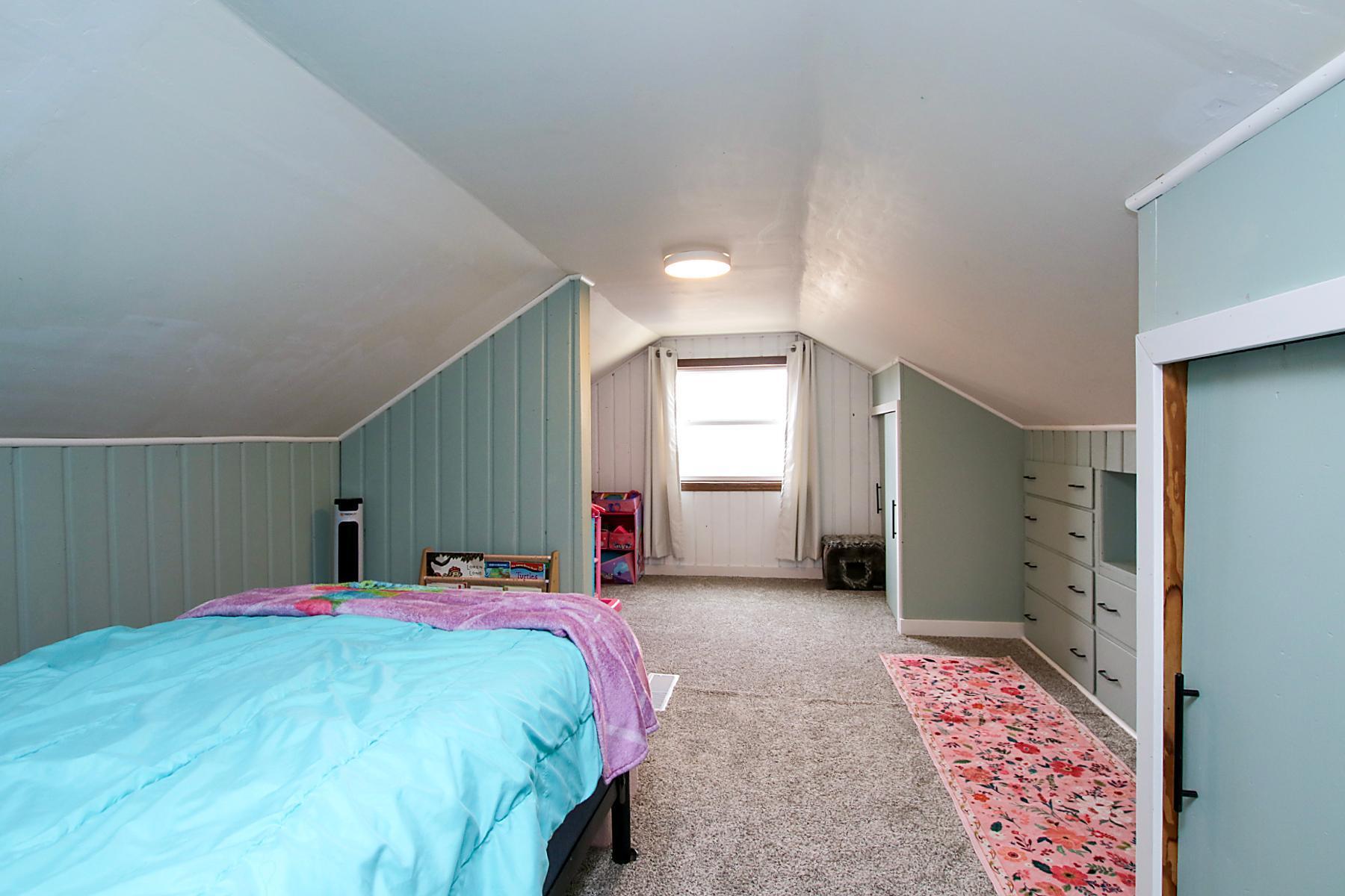Lots of floor space and built-ins. Near the window makes for a perfect reading nook!