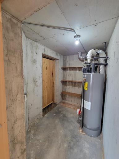 'safe room' with concrete walls...potentially a wine cellar?