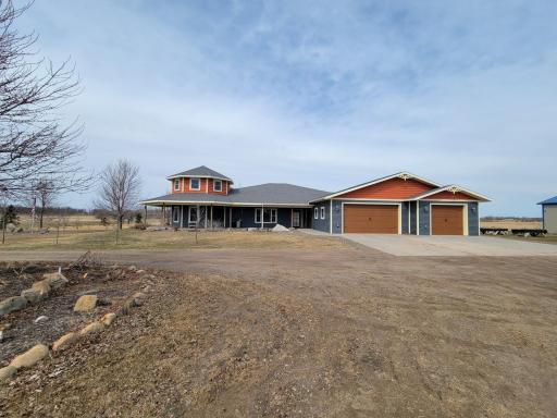 Triple attached garage plus the outbuilding