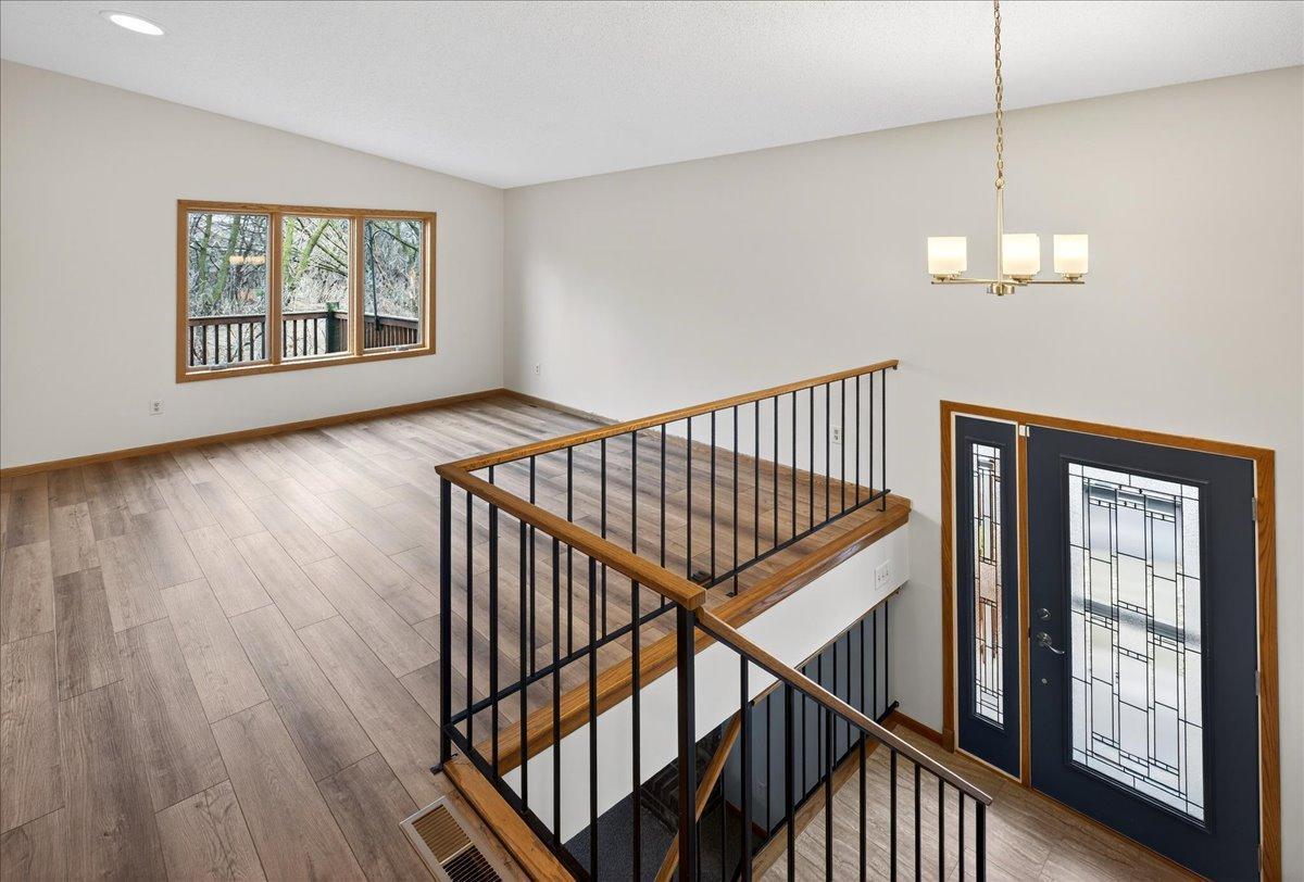 Living Room with NEW LVP flooring, NEW Foyer light