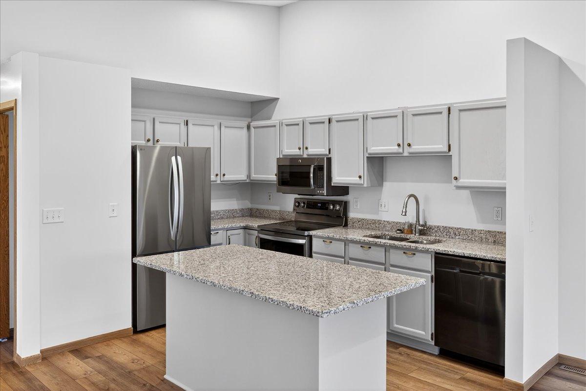 All NEW Kitchen with Granite Center Island, Granite on the perimeter, NEW sink and faucet, all NEW Stainless Appliances, new cabinet hardware