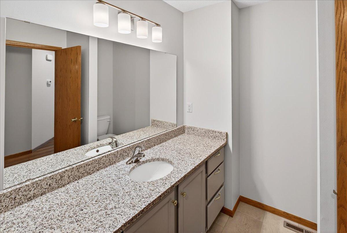 Granite Vanity with NEW sink and faucet, LVT floor