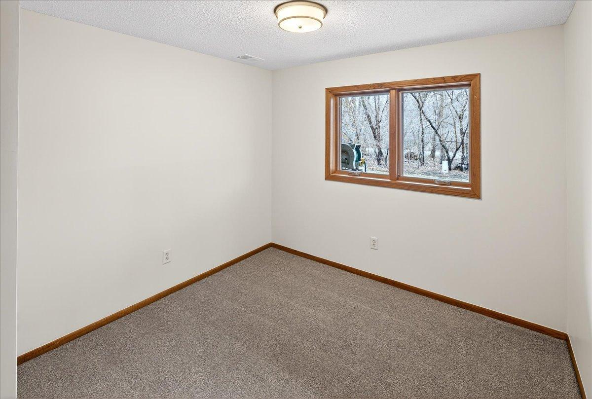 3rd Bedroom in lower level, NEW flooring