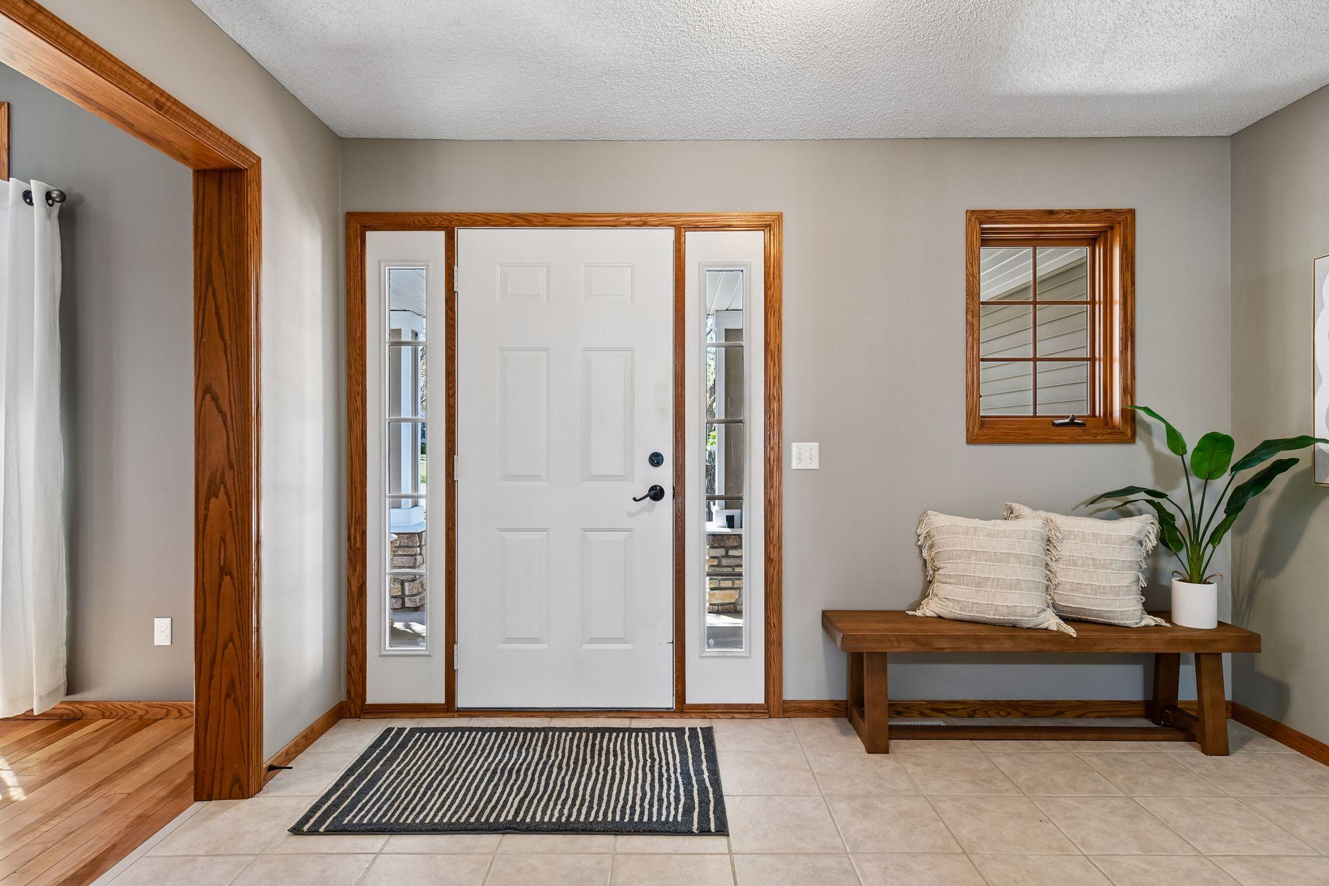 Spacious entryway ideal for welcoming guests, complete with a large front closet for convenient coat storage.