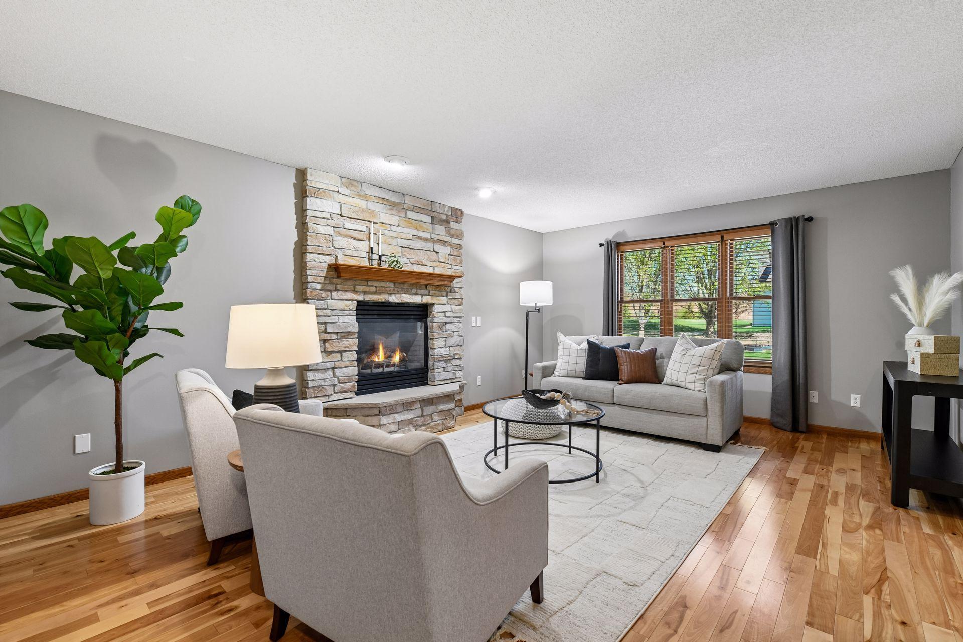 Relaxing family room with gas fireplace and gorgeous hardwood floors!