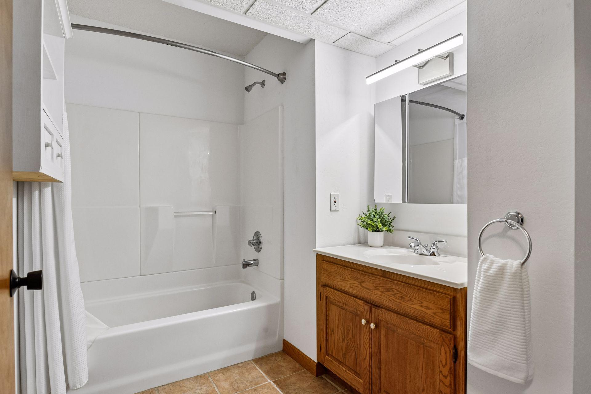 Lower level full bath with ceramic tile floor