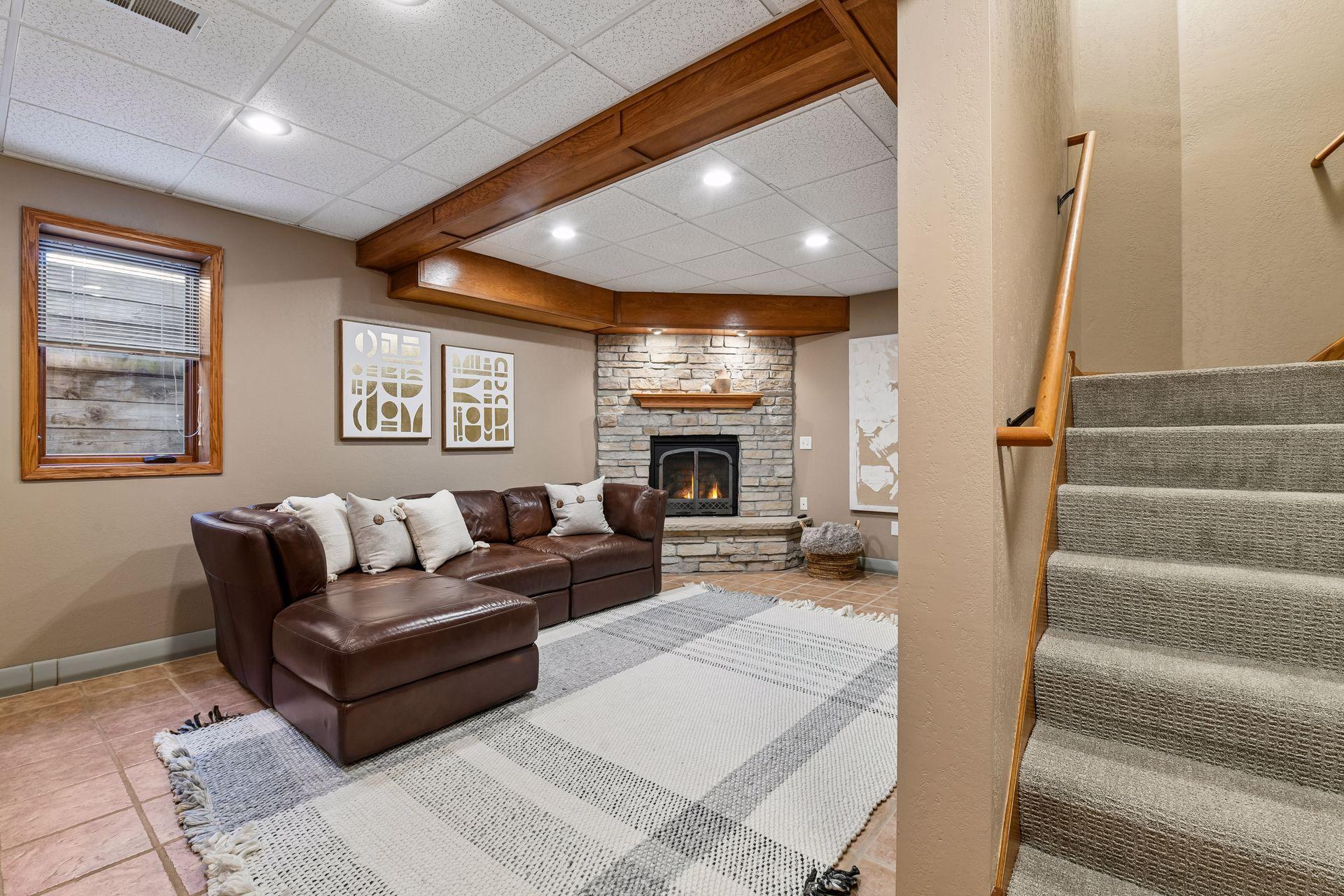 Fantastic lower level; ceramic flooring, gas fireplace with stack stone surround