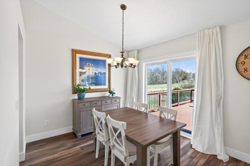Dining room has a patio door that opens to the deck