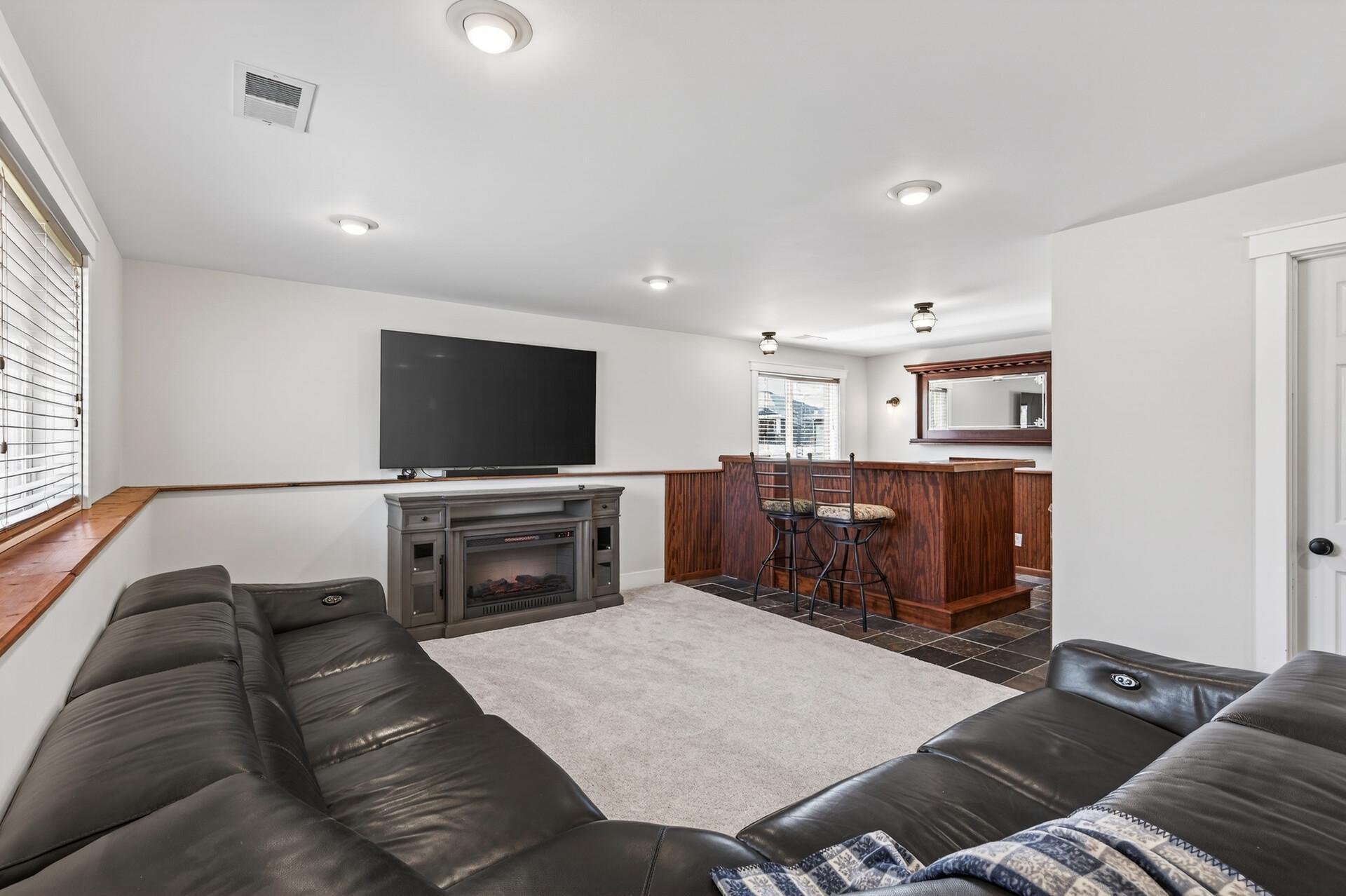 Family room plus a bar with slate floor