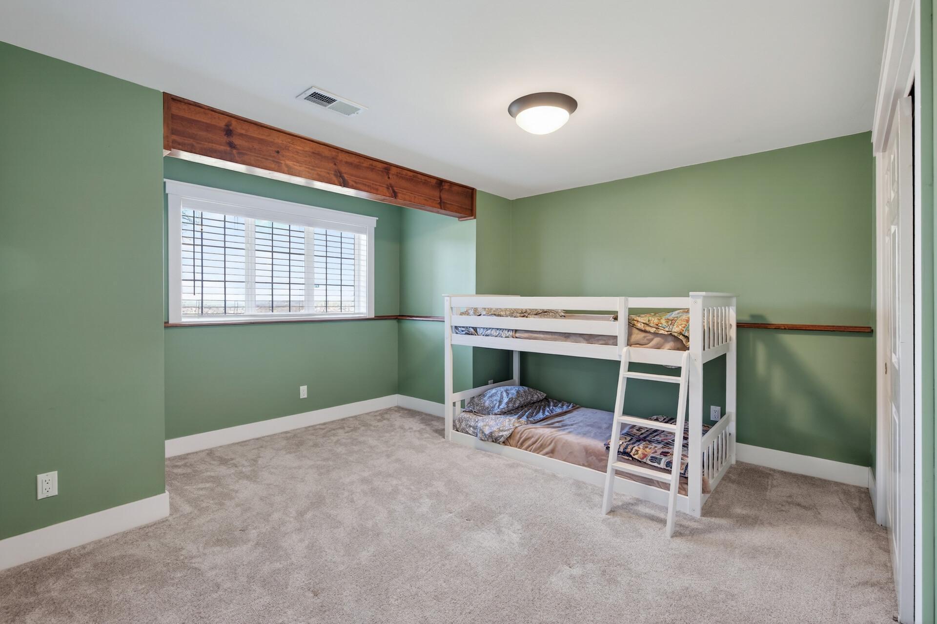 Spacious bedroom 4 is in the lower level