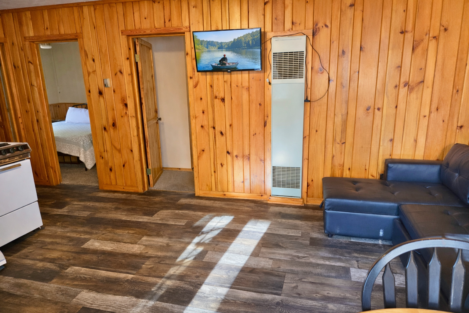 Cozy cabin living room with TV display.png