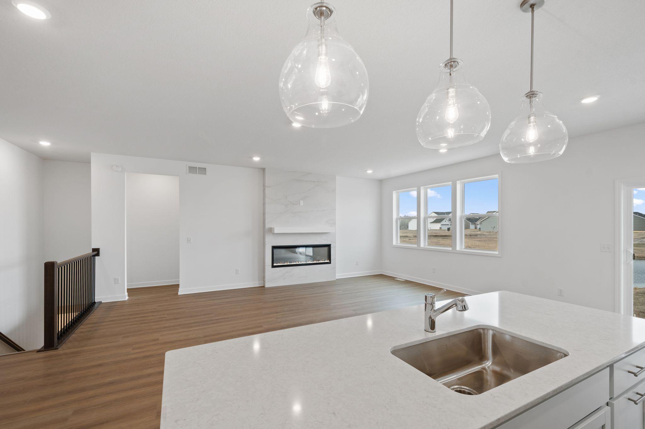 The kitchen overlooks the dining room for an easy transition between cooking and mealtime